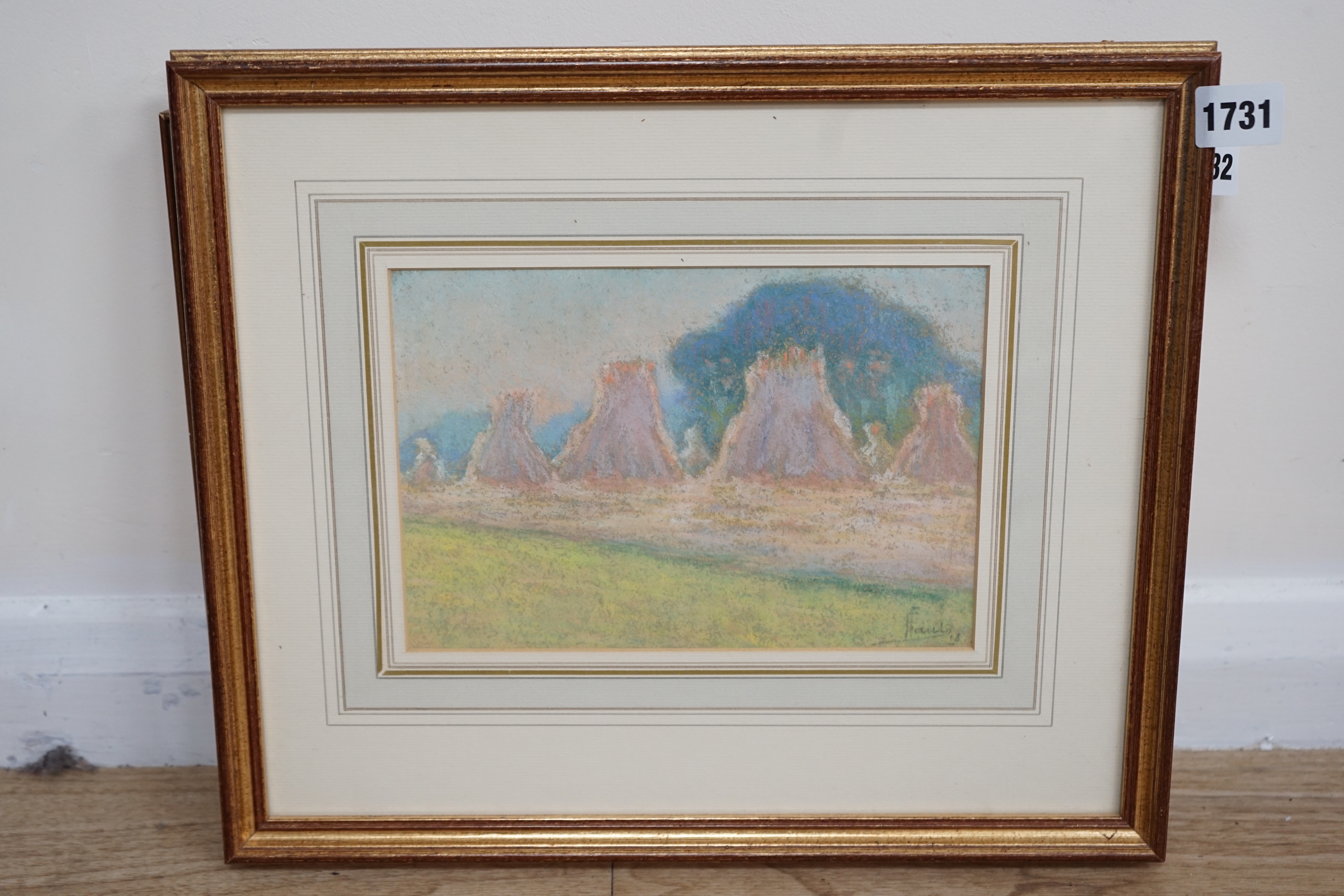 Ernest Faut (1879-1961) Impressionist pastel, Rural landscape with hayricks, signed, inscribed in ink verso, 15 x 23cm